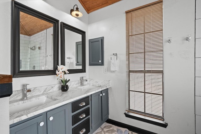 501 Battlecreek Ln, Leander, TX 78641 - full bath featuring double vanity, vaulted ceiling, wood ceiling, and tiled shower