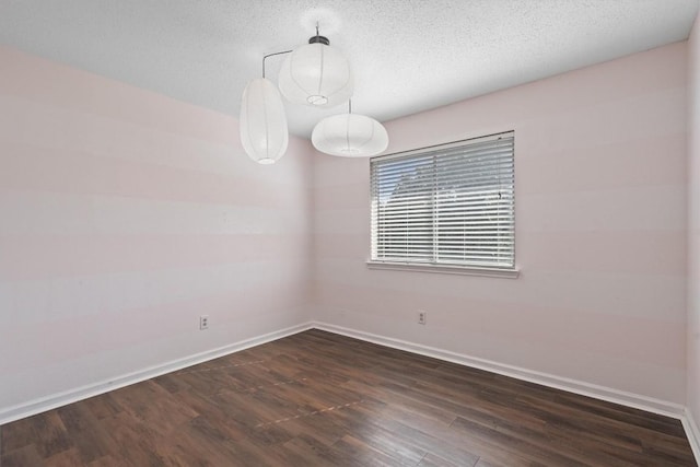 501 Battlecreek Ln, Leander, TX 78641 - unfurnished room featuring dark wood-style flooring and a textured ceiling