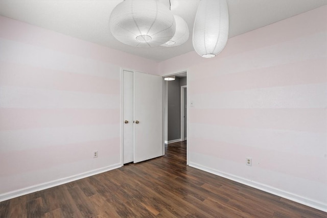 501 Battlecreek Ln, Leander, TX 78641 - empty room featuring baseboards and dark wood-style floors