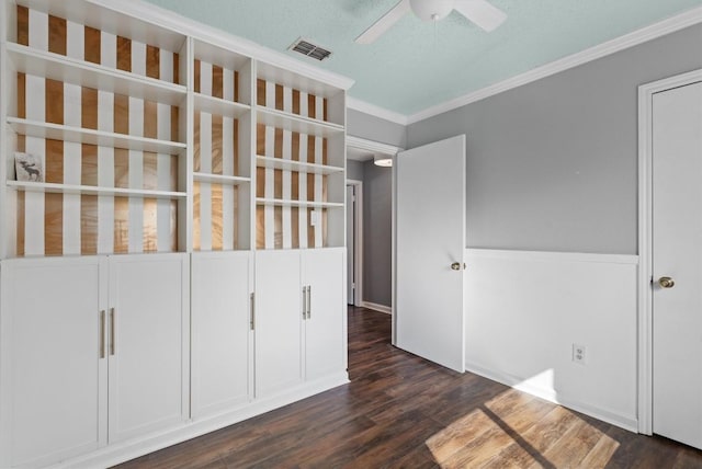 501 Battlecreek Ln, Leander, TX 78641 - unfurnished bedroom with dark wood-style flooring and crown molding
