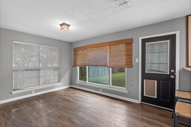 501 Battlecreek Ln, Leander, TX 78641 - foyer entrance featuring a textured ceiling and wood finished floors