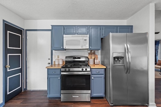 501 Battlecreek Ln, Leander, TX 78641 - kitchen featuring stainless steel appliances, blue cabinetry, light countertops, and a textured ceiling