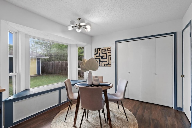 501 Battlecreek Ln, Leander, TX 78641 - dining area featuring a chandelier, wood finished floors, and a textured ceiling