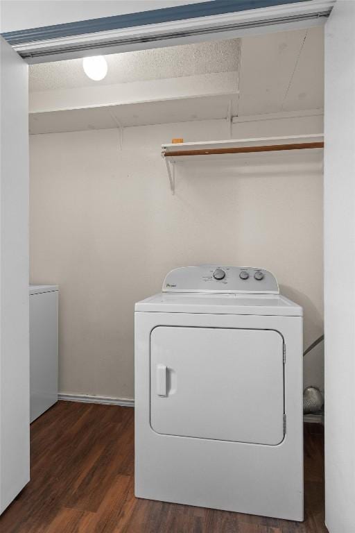 501 Battlecreek Ln, Leander, TX 78641 - laundry area with washing machine and clothes dryer and dark wood-style flooring
