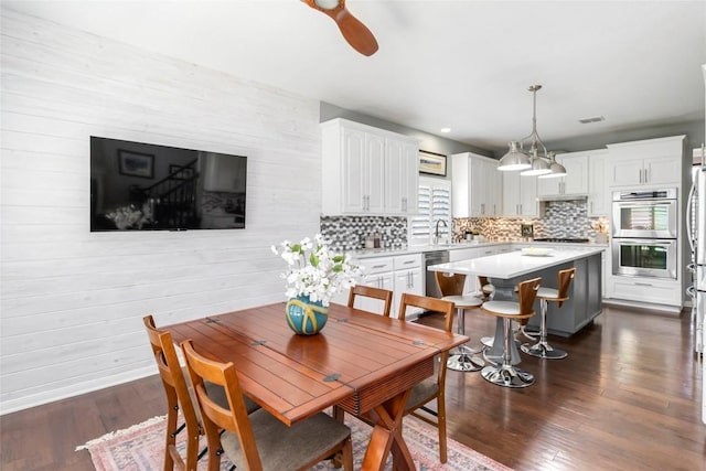 10601 Showboat Cv, Austin, TX 78730 - dining area with dark wood-style flooring and a ceiling fan