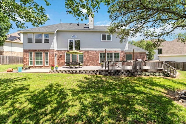 10601 Showboat Cv, Austin, TX 78730 - rear view of property with brick siding, a fenced backyard, a chimney, a deck, and a patio