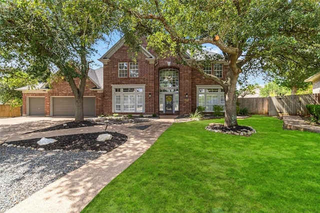 10601 Showboat Cv, Austin, TX 78730 - traditional home featuring brick siding, driveway, and a garage