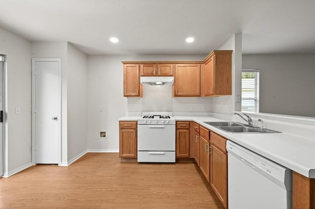 402 Colonial Park Blvd, Austin, TX 78745 - kitchen featuring white appliances, under cabinet range hood, light wood finished floors, light countertops, and recessed lighting