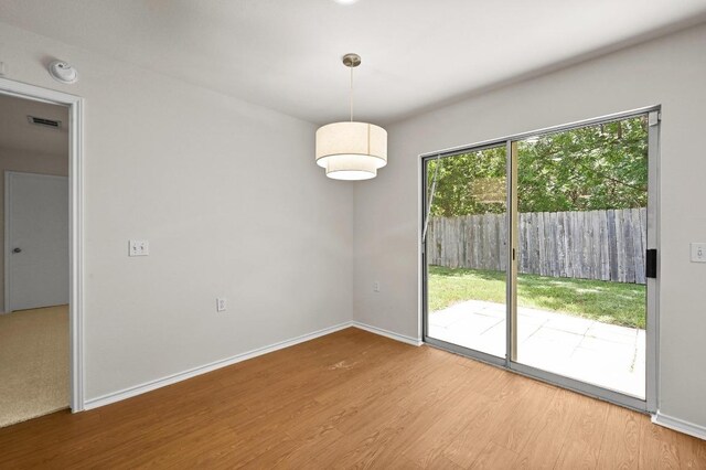 402 Colonial Park Blvd, Austin, TX 78745 - unfurnished dining area with wood finished floors and baseboards