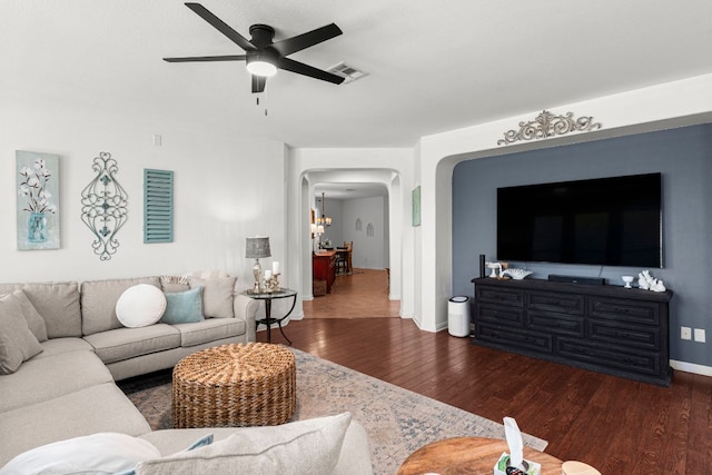 7625 Brecourt Manor Way, Austin, TX 78739 - living room with wood finished floors, arched walkways, and ceiling fan