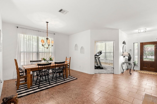 7625 Brecourt Manor Way, Austin, TX 78739 - dining room with a chandelier and baseboards