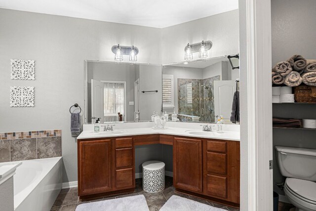 7625 Brecourt Manor Way, Austin, TX 78739 - bathroom featuring a shower stall, double vanity, a garden tub, and tile patterned flooring