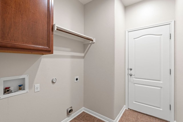 7625 Brecourt Manor Way, Austin, TX 78739 - laundry room featuring cabinet space, hookup for an electric dryer, hookup for a washing machine, gas dryer hookup, and tile patterned flooring