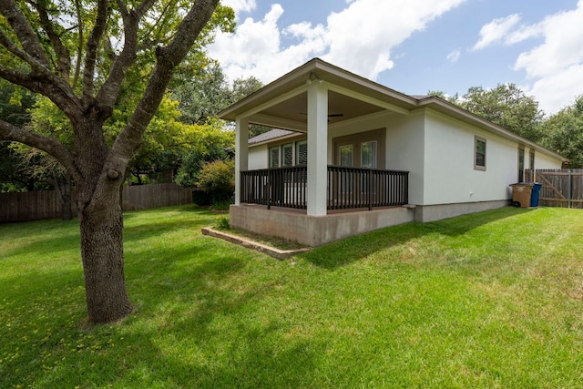 7625 Brecourt Manor Way, Austin, TX 78739 - back of property featuring a fenced backyard and stucco siding