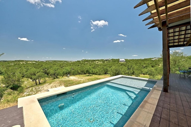 1010 Westland Ridge Rd, Dripping Springs, TX 78620 - swimming pool featuring a view of trees and a wooden deck