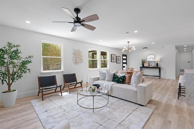 5604 Overbrook Dr, Austin, TX 78723 - living room featuring recessed lighting, light wood-type flooring, a chandelier, and a ceiling fan