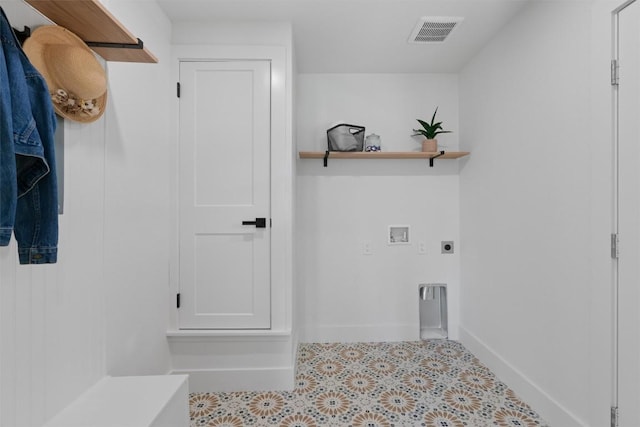 5604 Overbrook Dr, Austin, TX 78723 - laundry room with electric dryer hookup, hookup for a washing machine, and tile patterned flooring