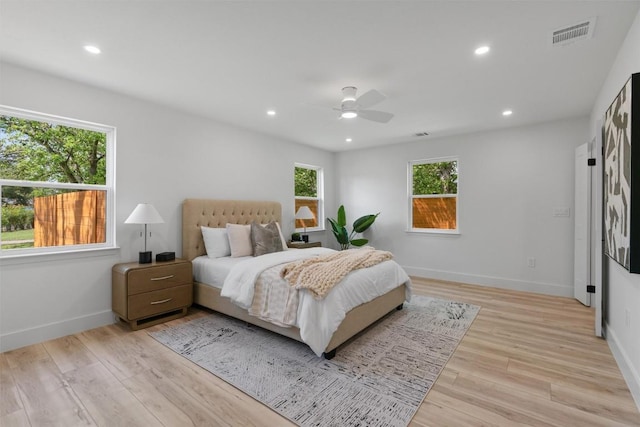 5604 Overbrook Dr, Austin, TX 78723 - bedroom with multiple windows, light wood finished floors, recessed lighting, and a ceiling fan