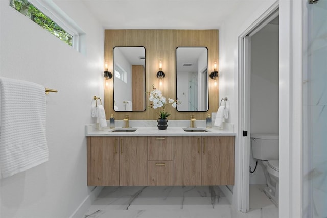 5604 Overbrook Dr, Austin, TX 78723 - full bathroom with double vanity and marble finish flooring