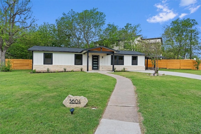 5604 Overbrook Dr, Austin, TX 78723 - view of front facade with stone siding and board and batten siding