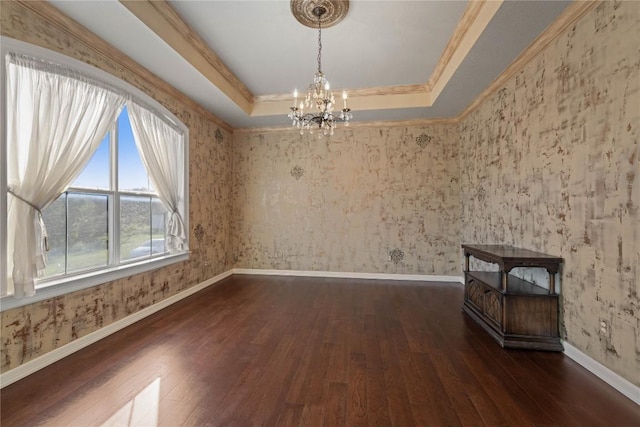 758 Mission Hts, New Braunfels, TX 78130 - spare room featuring hardwood / wood-style flooring, a tray ceiling, a chandelier, ornamental molding, and wallpapered walls