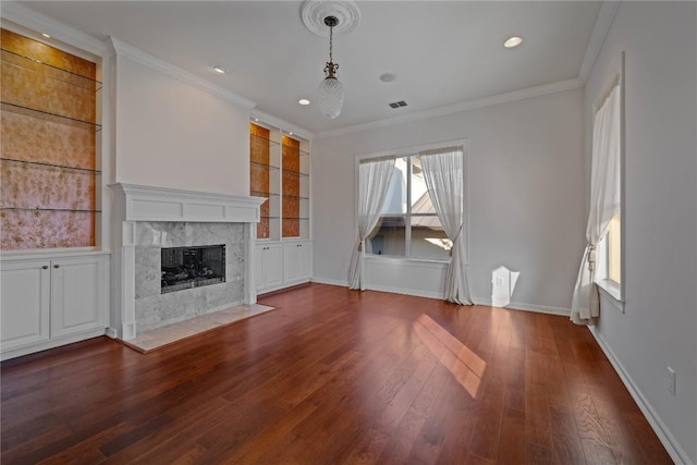 758 Mission Hts, New Braunfels, TX 78130 - unfurnished living room with dark wood-style floors, a premium fireplace, ornamental molding, built in features, and recessed lighting