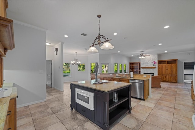 758 Mission Hts, New Braunfels, TX 78130 - kitchen with dishwasher, a stone fireplace, a kitchen island with sink, recessed lighting, and a chandelier