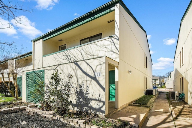 6718 Silvermine Dr Unit 201, Austin, TX 78736 - view of property exterior featuring a central AC unit and a balcony