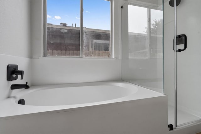 17129 Hamilton Point Cir, Manor, TX 78653 - bathroom with a shower stall and a garden tub