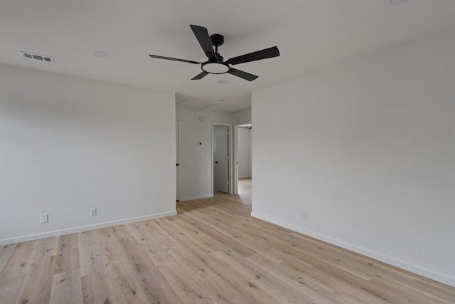 17129 Hamilton Point Cir, Manor, TX 78653 - empty room with light wood-style floors and ceiling fan