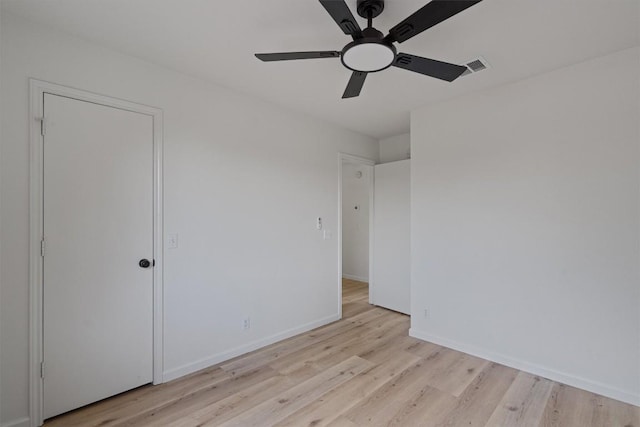 17129 Hamilton Point Cir, Manor, TX 78653 - unfurnished bedroom with light wood-style floors and ceiling fan
