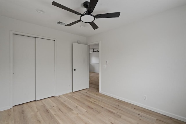 17129 Hamilton Point Cir, Manor, TX 78653 - unfurnished bedroom featuring light wood-type flooring, a closet, and ceiling fan