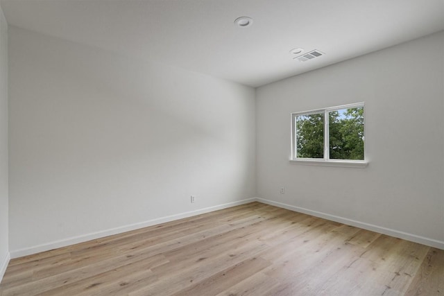 17129 Hamilton Point Cir, Manor, TX 78653 - empty room featuring wood finished floors and baseboards