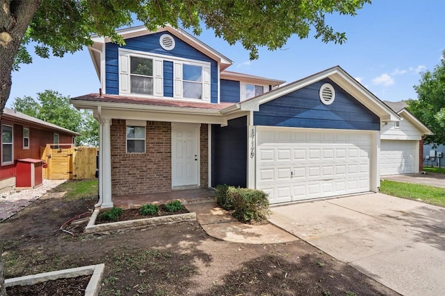 17129 Hamilton Point Cir, Manor, TX 78653 - view of front facade featuring brick siding, concrete driveway, and a garage