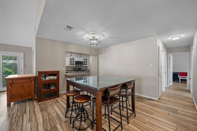 1300 Neans Dr, Austin, TX 78758 - dining space with baseboards and light wood-style floors