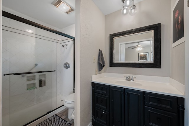 1300 Neans Dr, Austin, TX 78758 - bathroom featuring vanity, a stall shower, and a textured wall