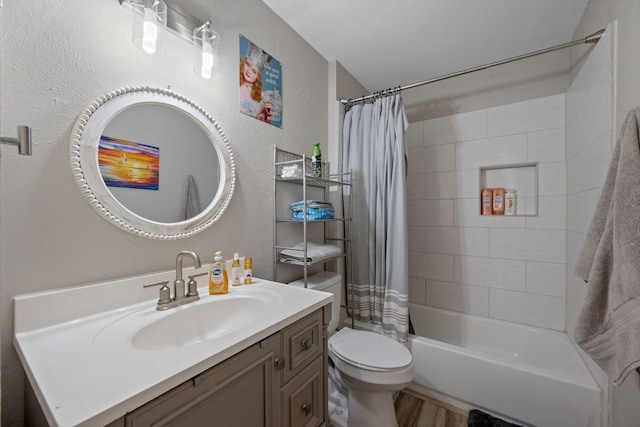 1300 Neans Dr, Austin, TX 78758 - bathroom with vanity, shower / bathtub combination with curtain, wood finished floors, and a textured wall