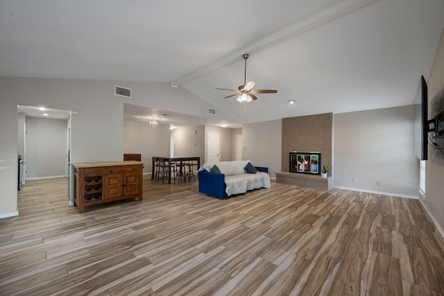 1300 Neans Dr, Austin, TX 78758 - living room featuring light wood-style floors, ceiling fan, and a fireplace