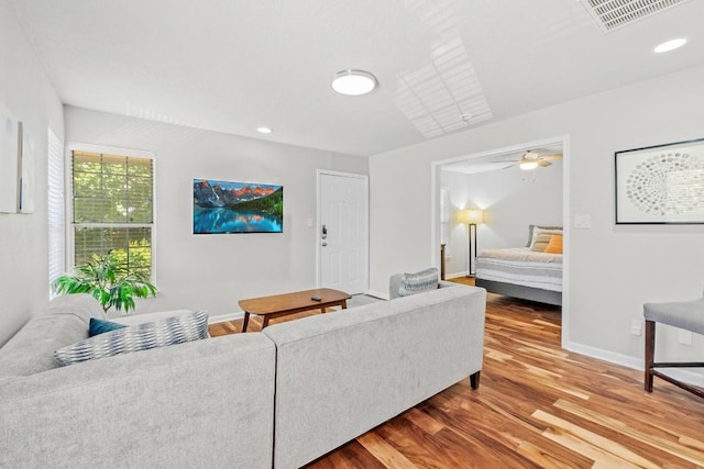 7685 Northcross Dr Unit 720, Austin, TX 78757 - living room featuring wood finished floors, recessed lighting, and a ceiling fan