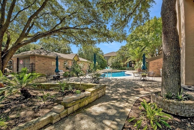 7685 Northcross Dr Unit 720, Austin, TX 78757 - swimming pool featuring a patio