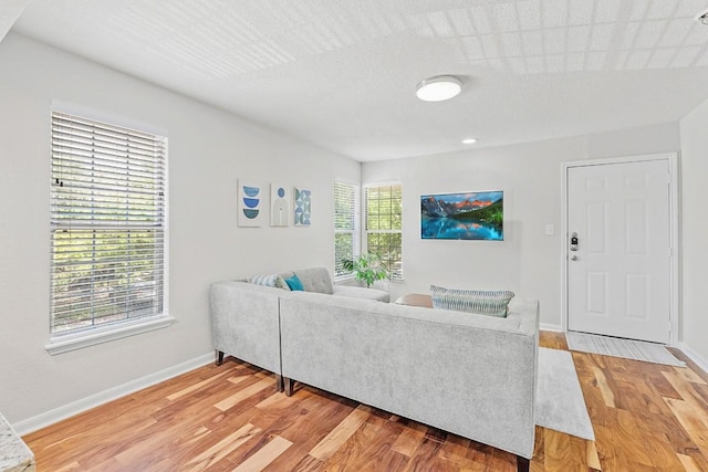 7685 Northcross Dr Unit 720, Austin, TX 78757 - living room with light wood-style flooring and baseboards
