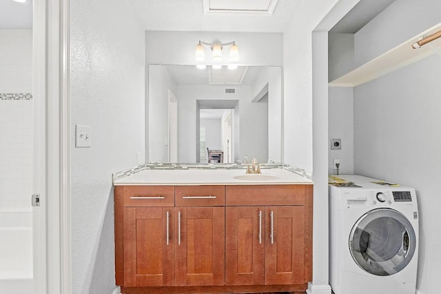 7685 Northcross Dr Unit 720, Austin, TX 78757 - full bathroom with washer / clothes dryer, vanity, and washtub / shower combination