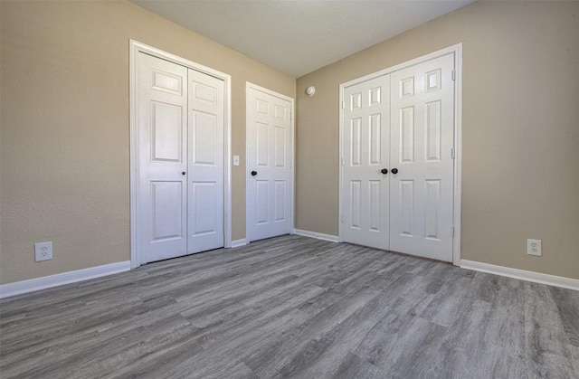 430 Zebra Dr, Kyle, TX 78640 - unfurnished bedroom with wood finished floors