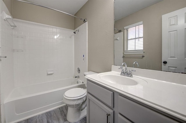 430 Zebra Dr, Kyle, TX 78640 - bathroom featuring wood finished floors, vanity, and washtub / shower combination