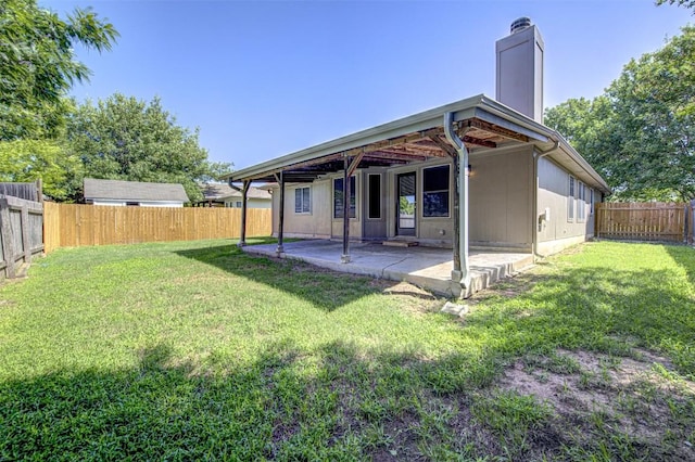 430 Zebra Dr, Kyle, TX 78640 - back of house featuring a patio, a fenced backyard, and a chimney