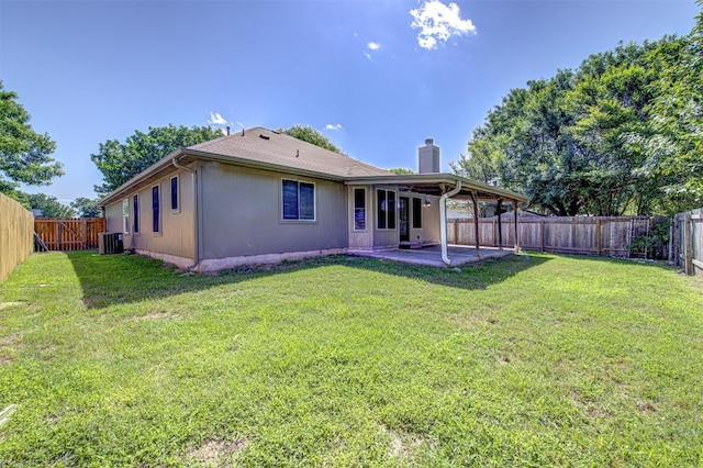 430 Zebra Dr, Kyle, TX 78640 - rear view of house with a chimney, a patio, and a fenced backyard