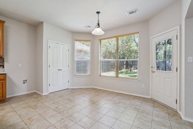 411 S Lynnwood Trl, Cedar Park, TX 78613 - unfurnished dining area with light tile patterned floors and baseboards