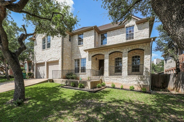 411 S Lynnwood Trl, Cedar Park, TX 78613 - french country style house featuring stone siding, a porch, an attached garage, and concrete driveway