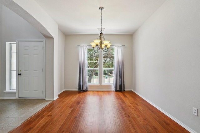 411 S Lynnwood Trl, Cedar Park, TX 78613 - foyer entrance with a chandelier, hardwood / wood-style floors, and arched walkways