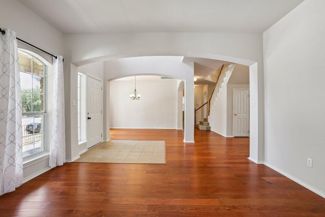 411 S Lynnwood Trl, Cedar Park, TX 78613 - entryway featuring arched walkways, wood finished floors, stairway, and a chandelier